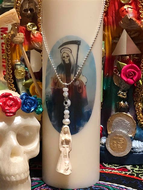 Love and Attraction: Unveiling the Romance of Santa Muerte Amulets